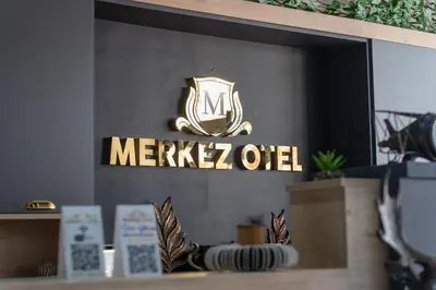 a sign on the wall of a mezzez office at Merkez Otel in Cerkezkoy
