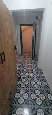 a hallway with a tile floor and a door at Studios & Balat in Istanbul