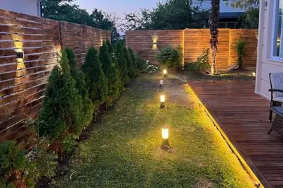 a garden with two lights on the grass at Villa 7even By Luxury Group in Buyukcekmece