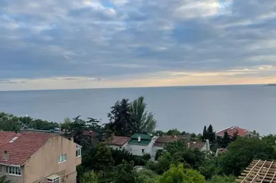 a city with houses and the ocean in the background at Villa 7even By Luxury Group in Buyukcekmece