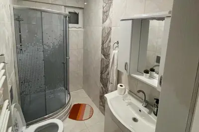 a bathroom with a shower and a sink and a toilet at Villa 7even By Luxury Group in Buyukcekmece