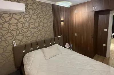 a bedroom with a bed and a wall with patterns at Villa 7even By Luxury Group in Buyukcekmece