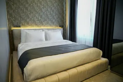 a bedroom with a large bed with a window at Elite World Homes Istanbul Bosphorus in Istanbul