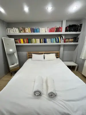a bedroom with a white bed with two towels on it at Heavenly Peace Stunning View Terrace Jacuzzi in Istanbul