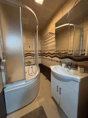 a bathroom with a shower and a sink and a tub at Heavenly Peace Stunning View Terrace Jacuzzi in Istanbul