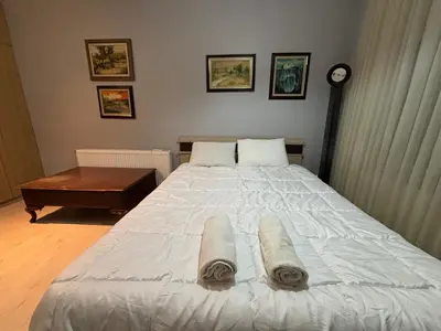 a bedroom with a large white bed with towels on it at Heavenly Peace Stunning View Terrace Jacuzzi in Istanbul