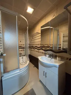 a bathroom with a shower and a sink and a tub at Heavenly Peace Stunning View Terrace Jacuzzi in Istanbul
