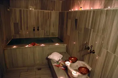 a bathroom with a shower with a sink and a tub at Kadi Konagi Thermal Hotel in Bursa
