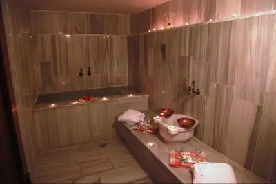 a bathroom with a tub and a shower with lights at Kadi Konagi Thermal Hotel in Bursa