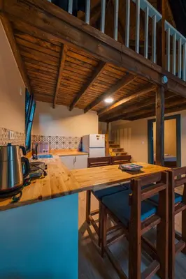 a kitchen with a wooden counter top in a room at Varuna Bungalov Evleri in Sapanca