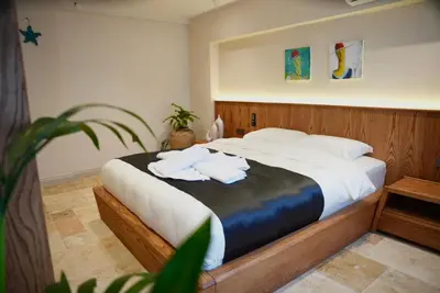 a bedroom with a bed with towels on it at Khalkedon Suites in Istanbul