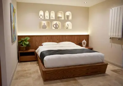 a bedroom with a large bed with plates on the wall at Khalkedon Suites in Istanbul