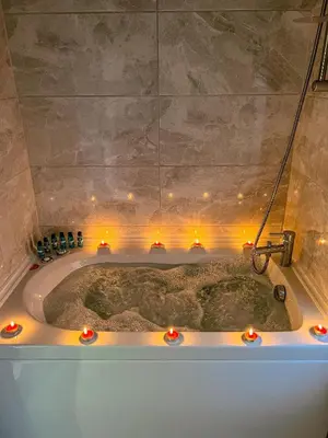 a bath tub with lights in a bathroom at Şifaköy Bungalov in Sapanca
