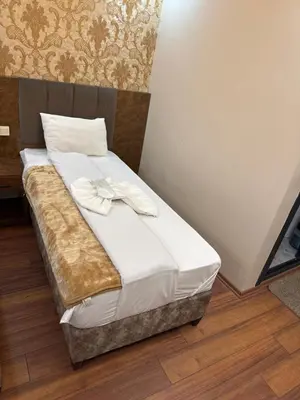 a bed in a room with white sheets and pillows at Hotel FORTYNİNE in Istanbul