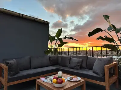 a living room with a couch and a table with fruit at Stunning Apt Near Metro - YM 2 in Istanbul