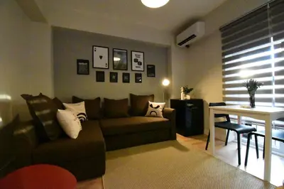 a living room with a couch and a table at Stunning Apt Near Metro - YM 2 in Istanbul