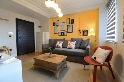 a living room with a couch and a coffee table at Stunning 2BR 3AC Near Metro - YM 3 in Istanbul