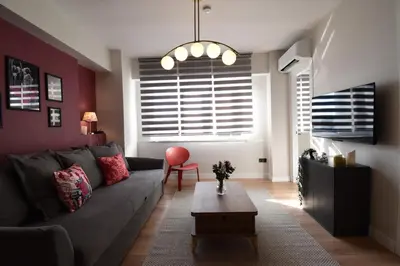 a living room with a couch and a table at Stunning Seaview 2BR near Metro - YM4 in Istanbul