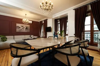a living room with a dining table and a couch at Spacious 2BR w AC Lift in Taksim - Kurabiye D2 in Istanbul