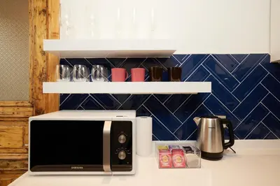 a kitchen counter with a toaster and a microwave at Spacious 2BR w AC Lift in Taksim - Kurabiye D2 in Istanbul