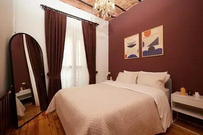 a bedroom with a white bed and a window at Spacious 2BR w AC Lift in Taksim - Kurabiye D2 in Istanbul