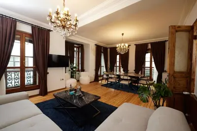 a living room with a couch and a table at Spacious 2BR w AC Lift in Taksim - Kurabiye D2 in Istanbul