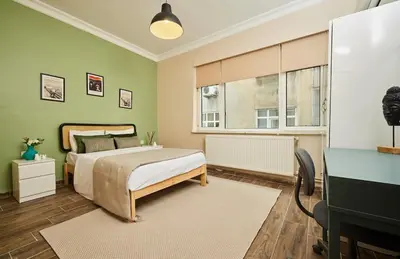 a bedroom with a bed and a desk and a window at Stunning 3BR 3Bathroom 3AC near Metro D2 in Istanbul