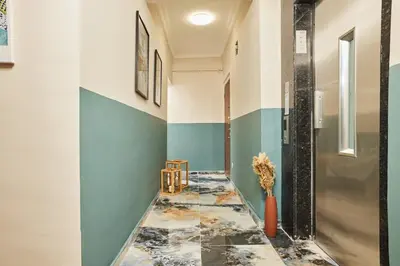a hallway with blue and white walls and a vase at Stunning 3BR 3Bathroom 3AC near Metro D3 in Istanbul
