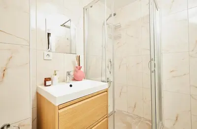 a bathroom with a sink and a shower at Stunning 3BR 3Bathroom 3AC near Metro D3 in Istanbul