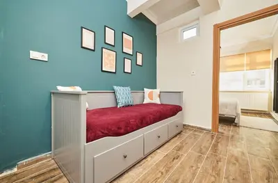 a bedroom with a bed with a red blanket at Stunning 3BR 3Bathroom 3AC near Metro D4 in Istanbul