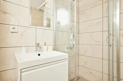 a bathroom with a sink and a shower at Stunning 3BR 3Bathroom 3AC near Metro D4 in Istanbul