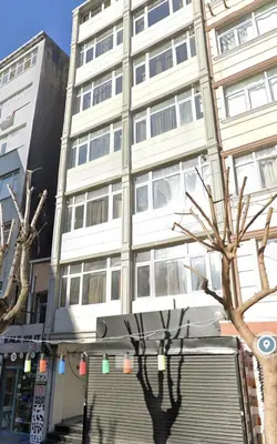 a tall white building with a tree in front of it at Stunning 3BR 3Bathroom 3AC near Metro D5 in Istanbul