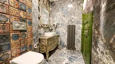a bathroom with a toilet and a sink at Emerald Mansion Hotel in Istanbul