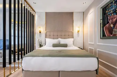 a bedroom with a bed and a large window at Veyron Hotels & SPA in Istanbul
