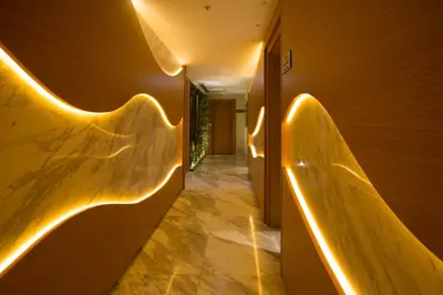 a hallway with indirect lighting on the wall at Veyron Hotels & SPA in Istanbul