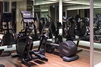 a gym with a lot of treadmills and ellipticals at Delta Hotels by Marriott Istanbul Levent in Istanbul