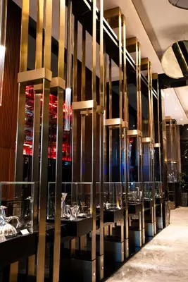 a row of tables in a restaurant with lights at Delta Hotels by Marriott Istanbul Levent in Istanbul