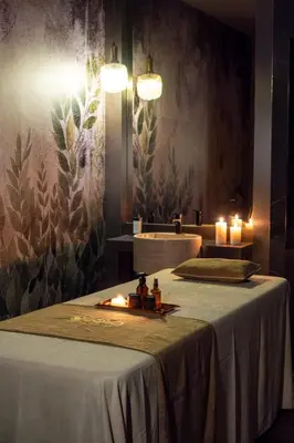 a room with two beds with candles and a mirror at Delta Hotels by Marriott Istanbul Levent in Istanbul