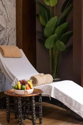 a bowl of fruit on a table next to a bed at Delta Hotels by Marriott Istanbul Levent in Istanbul