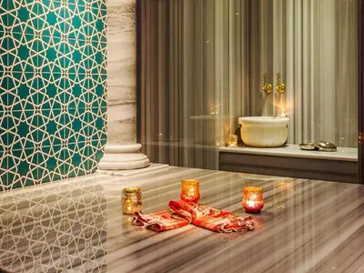 a room with candles on a table with a bathroom at Nidya Hotel Esenyurt in Istanbul