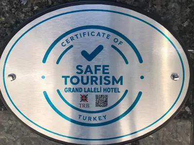 a metal sign that reads gate tourism grand lake hotel at Grand Laleli Hotel in Istanbul