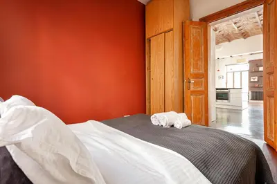 a bedroom with a bed with two towels on it at Beautiful restored historical apartment in Galata in Istanbul