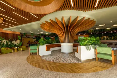 a lobby with a large building with plants at ibis Styles Istanbul Kurtkoy in Istanbul