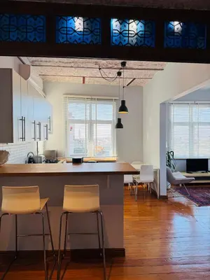 a kitchen with chairs and a counter in a room at 3BR,Charming Flat,Golden Horn View in Istanbul