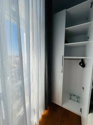 a room with a window with a white curtain at 3BR,Charming Flat,Golden Horn View in Istanbul