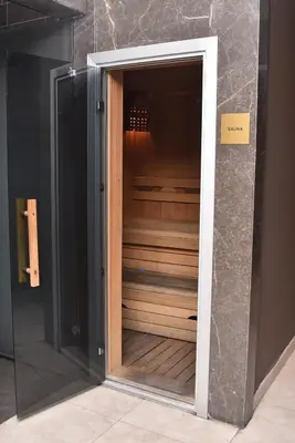a glass door leading into a walk in closet at Yakut Suite in Istanbul