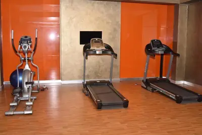 a gym with three exercise bikes in a room at Yakut Suite in Istanbul
