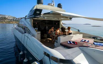 a group of people sitting on a boat in the water at Samtek in Istanbul