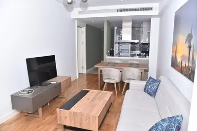 a living room with a white couch and a table at Sedef Suite in Istanbul