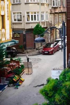a view of a street with a red car and an umbrella at Atam Suites in Istanbul